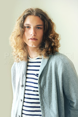 Buy stock photo Long hair, man or fashion for portrait with hipster style clothing or shirt on white background. Face, person or headshot of young stylish gen z male model with cool confidence and pride in studio