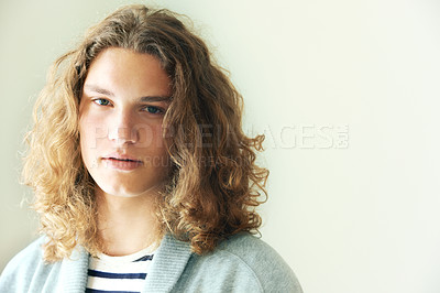 Buy stock photo Long hair, man or fashion for portrait on mockup space in studio in hipster style clothing on white background. Face, person or headshot of stylish gen z male model with cool confidence and pride