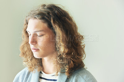 Buy stock photo Lonely, man and thinking at window in home, apartment or living room with ideas. Calm, breathing and college student alone in house with brain fog, memory or remember a decision or choice in bedroom