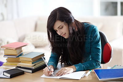 Buy stock photo Books, education and girl writing in book for learning, assignment or homework in her home. Student, female and notebook at table for project, planning and brainstorming, creative and idea notes 