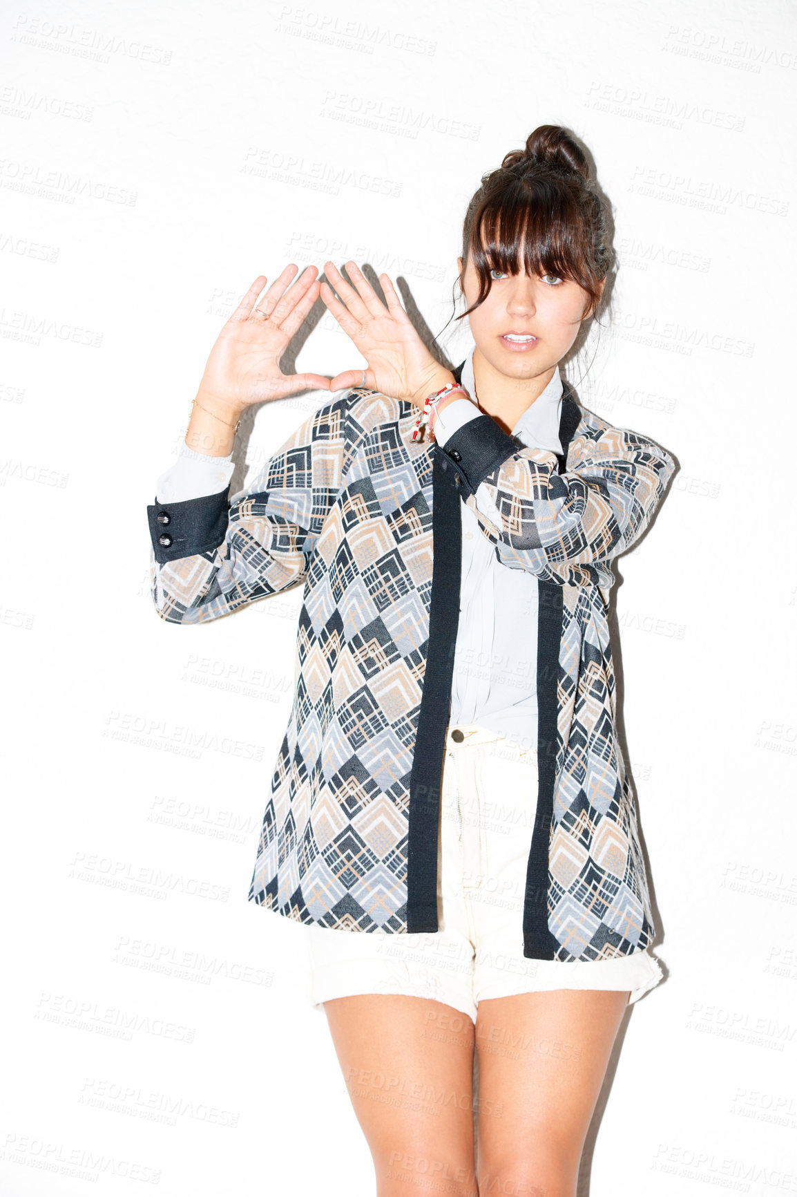 Buy stock photo Portrait, woman and triangle hand sign at studio isolated on a white background. Palm, pyramid and model frame fingers, symbol for diamond or fashion clothes, style and trendy hipster or cool person