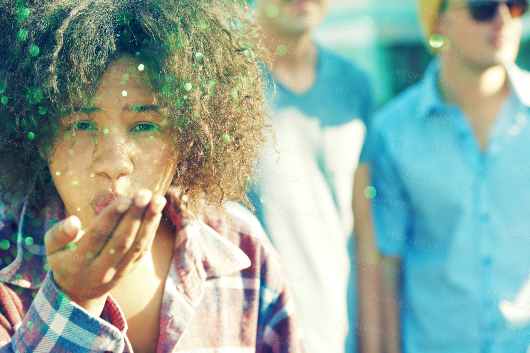 Buy stock photo Young woman blowing away a handful of glitter