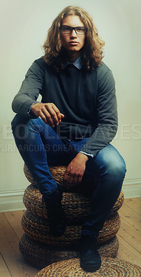 Buy stock photo Man, portrait and fashion or style trendy clothes, wall background or long hair. Male person, model and face glasses for denim outfit or indoor confidence for edgy unique, serious cool or fresh look