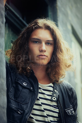 Buy stock photo Man, portrait and serious outdoor for fashion, urban style and edgy outfit with confidence and pride. Person, face and young model with casual jacket, long hairstyle and stylish with calm expression