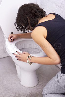 Buy stock photo Woman, toilet and sick with bulimia or anorexia, problem and anxious need to control weight with vomiting. Girl, bathroom and eating disorder habit or puke, nausea and hurt stomach after meal
