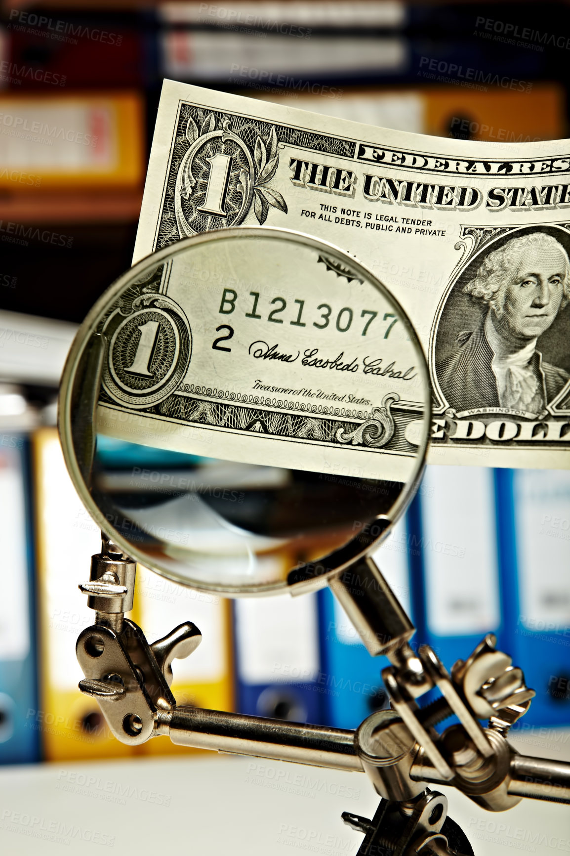 Buy stock photo A dollar bill being magnified by a magnifying glass
