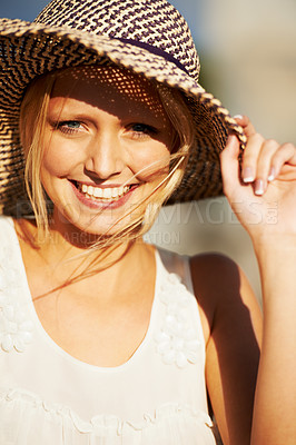 Buy stock photo A beautiful young woman wearing a straw hat