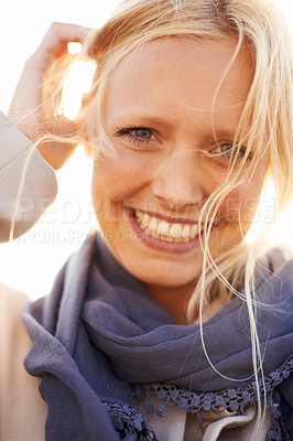 Buy stock photo Woman, beauty and portrait with smile in sunshine, outdoor or spring fashion or happiness. Closeup, wind and natural face for vacation, holiday or wellness in summer from dermatology skincare