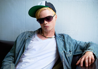 Buy stock photo Attractive young blond guy wearing street-style clothing and a smirk