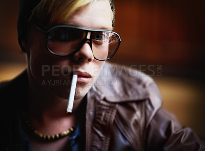 Buy stock photo Portrait, addiction and a boy smoking a cigarette closeup for nicotine or tobacco dependency in sunglasses. Face, smoke and bad habit with a young person inhaling an addictive substance for cancer