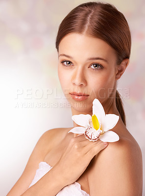 Buy stock photo Woman, portrait and flower for wellness in studio, beauty and skincare for care, elegant and cosmetic. Female model person, floral and brunette or spa treatment, organic body care and background