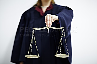 Buy stock photo Conceptual image of a judge holding a scale