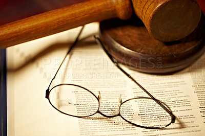 Buy stock photo Table, law and a report, glasses and gavel for a court decision, notes or a justice report. Closeup, desk and paperwork or a dictionary for legal knowledge, courtroom words or a crime defense