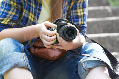 Buy stock photo Woman, photographer hands and camera for travel picture sitting on garden steps. Journey, photo and photography of a female person in a urban park traveling and outdoor on holiday with hobby