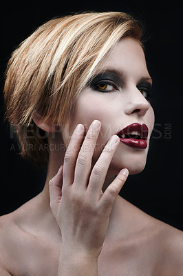 Buy stock photo Portrait, hand and a woman vampire in studio on a dark background as a cosplay monster. Fantasy, horror or scary with an attractive young halloween female person posing as an evil and supernatural