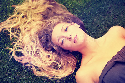 Buy stock photo Portrait, hair and a woman on the grass from above to relax in nature during summer for freedom. Face, beauty and a girl in the park, lying on a field outdoor to rest on a green background alone