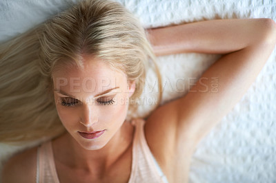 Buy stock photo Woman, eyes closed and face for beauty, makeup or cosmetic in bedroom in Norway by above. Person, relax or calm for satisfaction in result, pigment or application of eyeshadow, lipstick or foundation