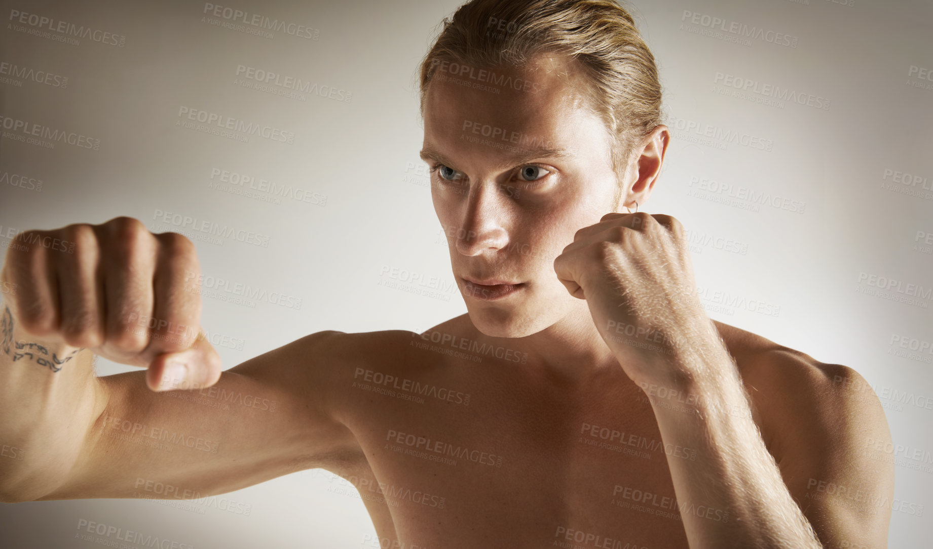 Buy stock photo Fighting, conflict and shirtless with man, training and fitness on a white studio background. Person, guy and professional with exercise, practice for a match and muscle with workout and competition
