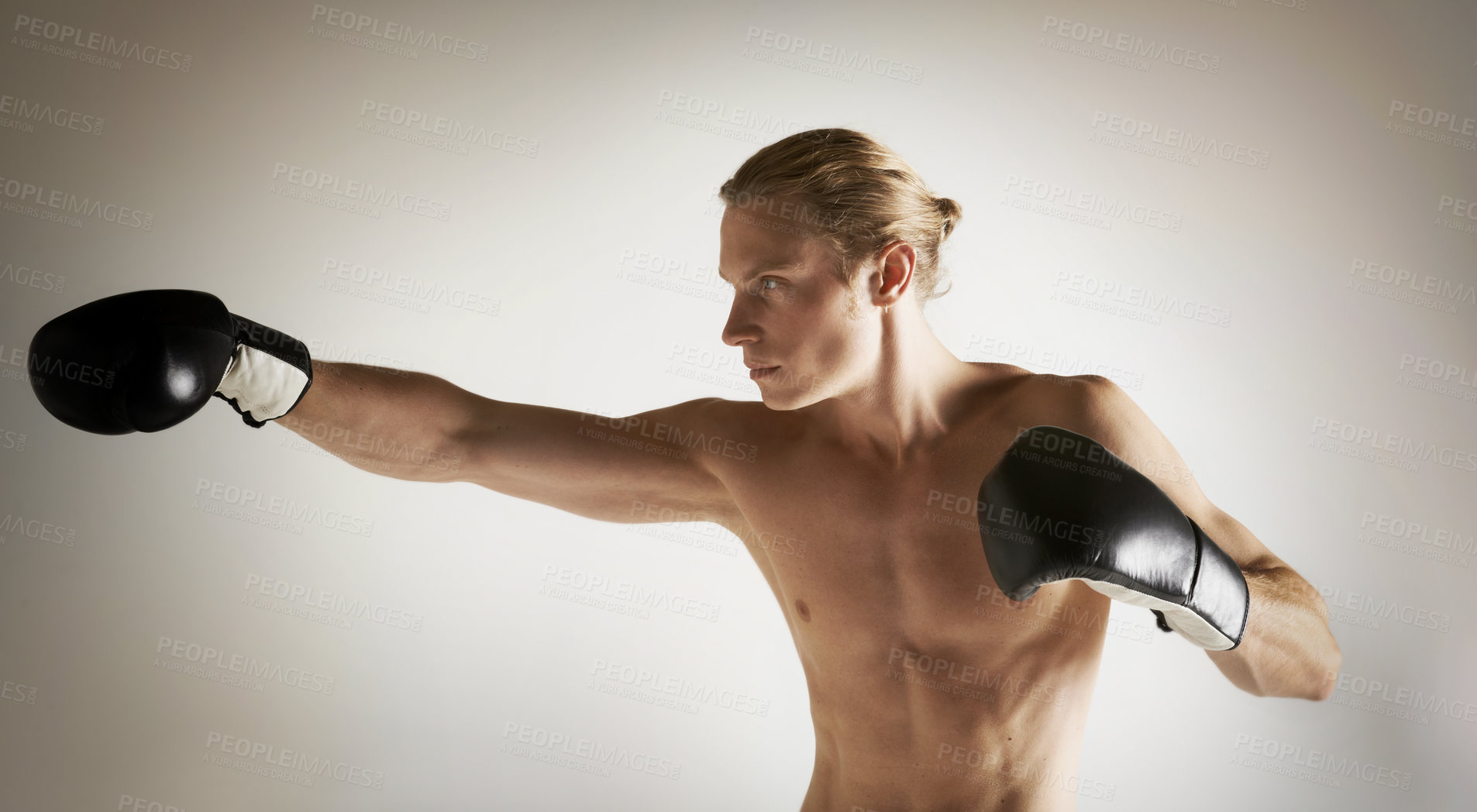 Buy stock photo Fighting, boxing and shirtless with man, training and exercise with health on a studio white background. Person, guy and professional with competition, practice for a match and muscle with workout