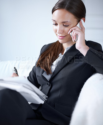 Buy stock photo Business woman, phone call and notebook on sofa for schedule management, communication and remote work. Entrepreneur, smile and listening with smartphone, book and writing on couch in home office