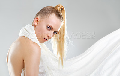 Buy stock photo Beauty, makeup and fabric, portrait of woman in studio with skin glow, creative facial and luxury skincare. Fashion, cosmetics and face of model with unique aesthetic on white background with silk.
