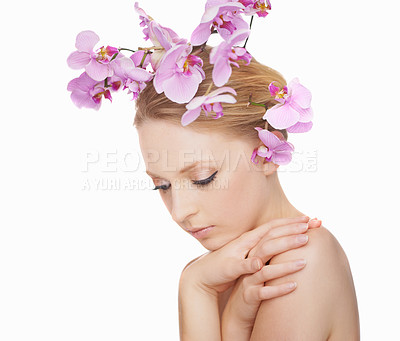 Buy stock photo Gorgeous young woman on a white background with pink orchids in her hair