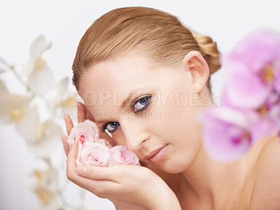 Buy stock photo Beauty, flowers and portrait of woman for facial spa treatment and special floral aesthetic in studio. Boho fashion, skincare and face of model with roses, wellness and salon dermatology with nature.