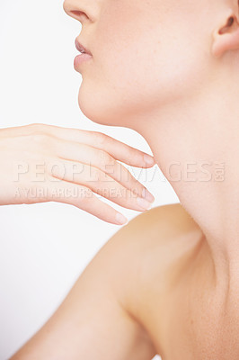 Buy stock photo Cropped view of a young woman touching her shoulder