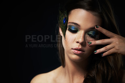Buy stock photo Shot of a beautiful young woman with her eyes closed and dramatic makeup