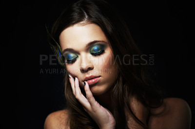 Buy stock photo Shot of a beautiful young woman with her eyes closed and dramatic makeup
