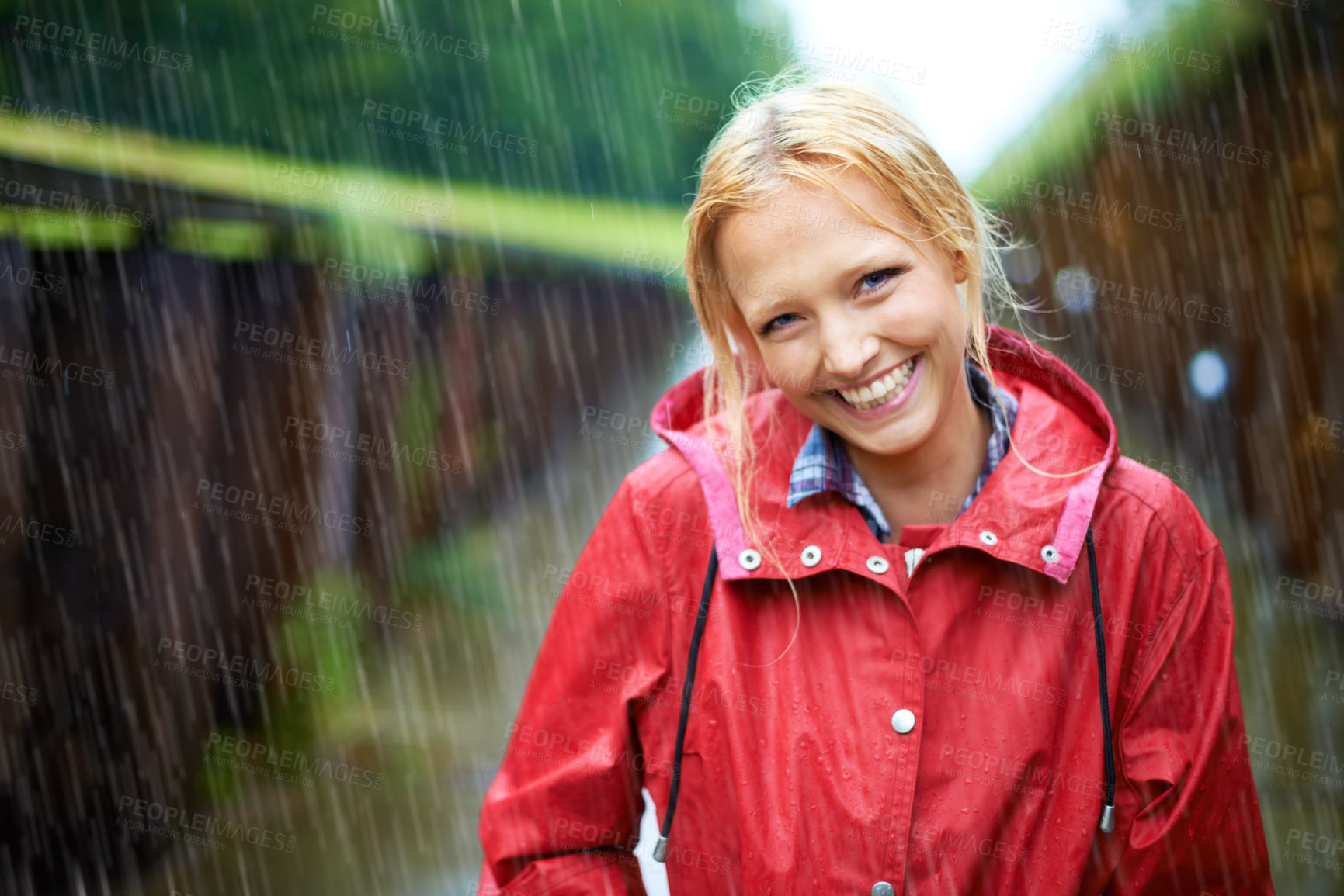 Buy stock photo Woman, smile and raincoat in outdoor storm, wet and cold from weather, winter and nature. Happy female person, fashion and red jacket is cool, rainfall and protection from water, face and travelling