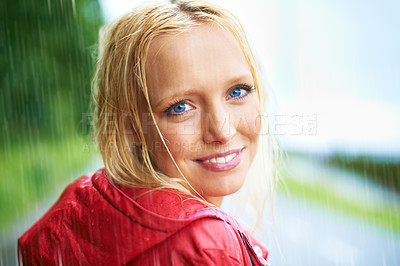 Buy stock photo Happy, smile and young woman in the rain with coat in nature, road or street for winter. Portrait, positive attitude and female person from Australia in drizzle or storm weather in outdoor forest.