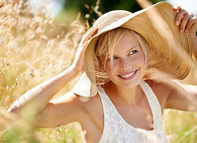 Buy stock photo Happy, hat and wheat with woman in field for travel, vacation and holiday. Smile, peace and nature with female person and grass in countryside meadow for calm environment, spring and sunshine