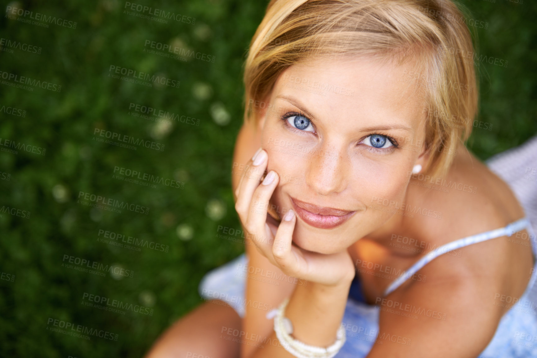 Buy stock photo Smile, nature and portrait of woman in garden for holiday in summer on outdoor adventure mockup from above. Happiness, freedom and face of girl on grass in park for vacation countryside to relax.