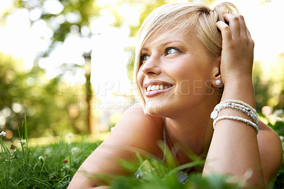 Buy stock photo Thinking, field and woman with ideas, grass and relax with sunshine, outdoor and wellness with peace. Person, happiness and girl on the ground, summer and daydreaming with adventure, smile and nature