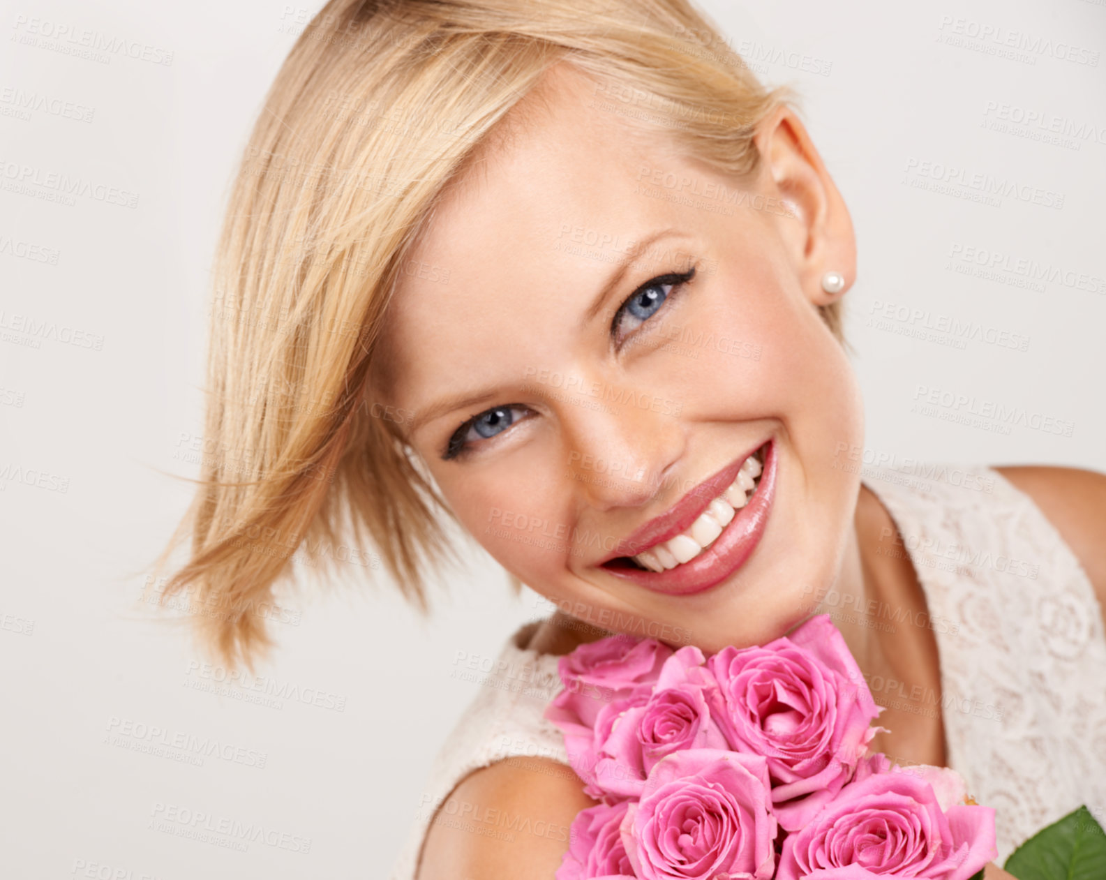 Buy stock photo Rose, bouquet and flowers with portrait of woman in studio for floral, valentines day and romance. Plants, gift and happy with person and smile on white background for elegant, love and present 