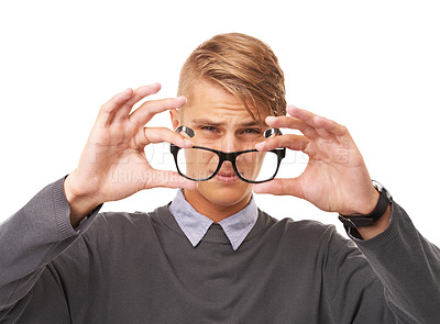 Buy stock photo Glasses, vision and portrait of man in a studio with confused, doubt or squinting facial expression. Optometry, health and young male person with spectacles or eyewear isolated by white background.