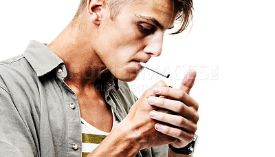 Buy stock photo Stress, studio and man lighting a cigarette with a lighter to smoke for an addiction or habit to relax. Dangerous, smoker or person from Germany smoking tobacco isolated by a white background alone