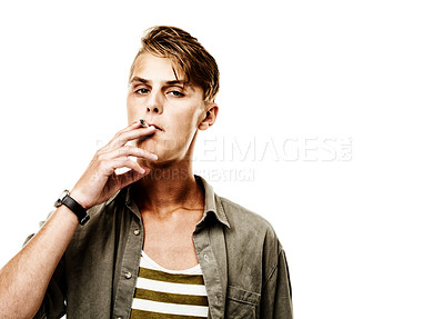 Buy stock photo Portrait, space or model smoking a cigarette for stress, toxic addiction or unhealthy habit to relax. Dangerous, smoker or cool man in Germany to inhale tobacco on white background or studio mockup
