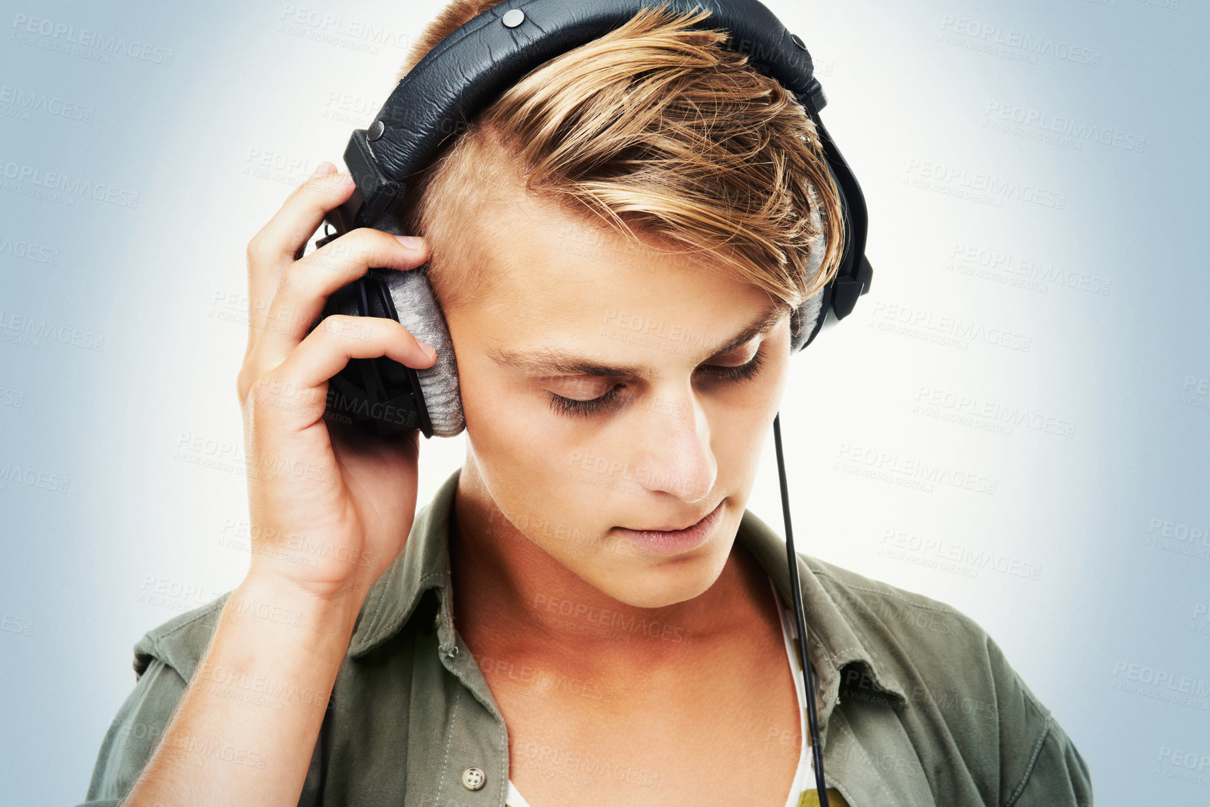 Buy stock photo Man, DJ and headphones listening to music in audio streaming, event or party against a studio background. Male person, sound artist or model with headset for podcast, beats or radio track on mockup