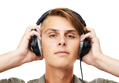 Buy stock photo Man, face and portrait with headphones listening to music in audio streaming against a studio background. Closeup of male person, DJ or model with headset for podcast, beats or sound track on mockup