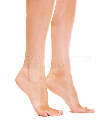 Buy stock photo Closeup of a young woman's feet standing on her tiptoes
