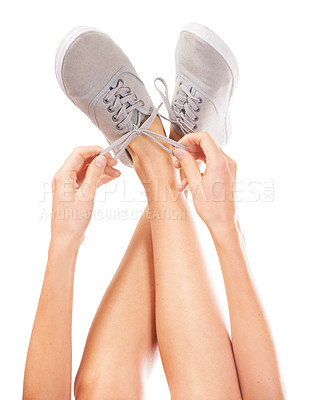 Buy stock photo Sneakers, white background and person tie shoes for fashion, trendy style and designer in studio. Footwear, legs and hands tying shoelace on feet isolated for walking, running and hiking or sports