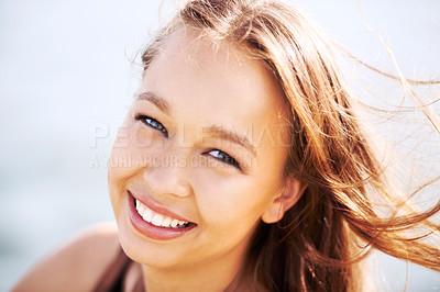 Buy stock photo Portrait, beauty and happy woman with wind in hair outdoor, cosmetics and wellness in summer. Face, confidence and smile of attractive person or girl for facial, natural and healthy skin in Spain