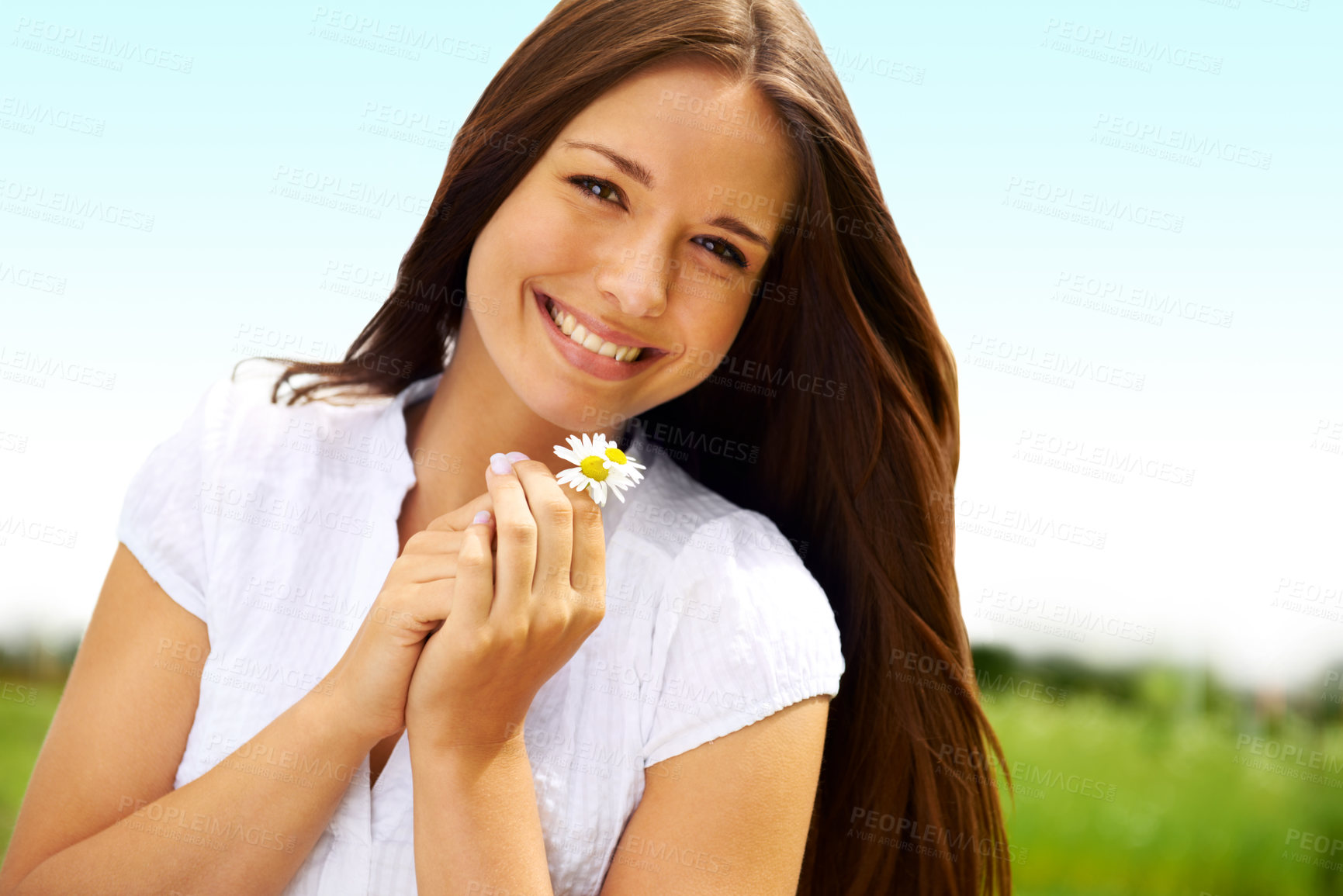 Buy stock photo Portrait, smile and woman with daisy outdoor, on holiday and enjoying spring on vacation in countryside. Face, flower plant and beauty of female person relaxing, smiling and having fun in nature.
