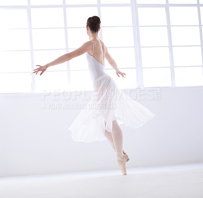 Buy stock photo Dance, ballet and theatre with woman in studio for balance, elegant and performance. Artist, creative and training with female ballerina dancing in class for competition, freedom and commitment