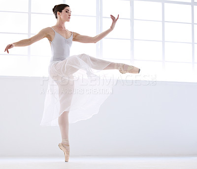 Buy stock photo Dance, ballet and moving with woman in studio for balance, elegant and performance. Artist, theatre and training with female ballerina dancing in class for competition, freedom and commitment