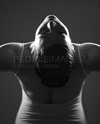 Buy stock photo Dance, ballet and monochrome with a woman in studio on a dark background for creative, art or expression. Theatre, broadway or performance with a young female ballerina or dancer in black and white