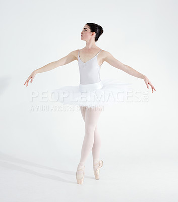 Buy stock photo Dance, ballet and performance with woman in studio for balance, elegant and creative. Artist, theatre and training with ballerina dancing ion white background for competition, freedom and commitment
