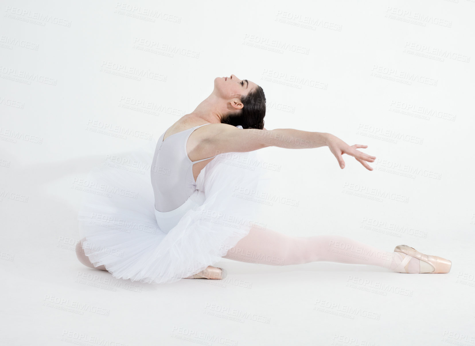 Buy stock photo Theatre, dance and ballet with a woman in studio on a white background for rehearsal or recital for a dancing performance. Art, creative and expression with a young ballerina or dancer in uniform